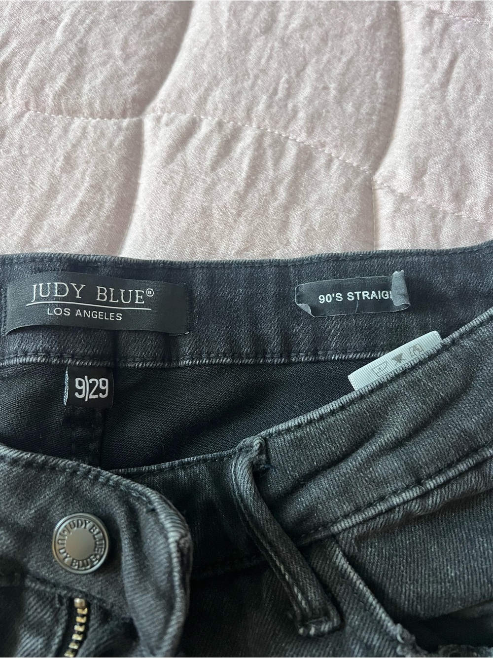 Distressed black denim jeans